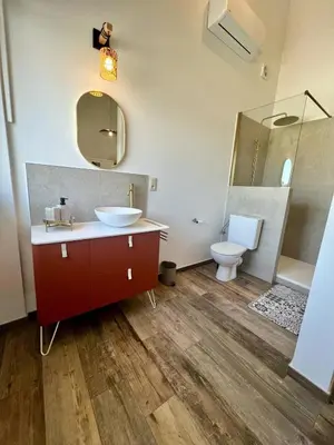 a bathroom with a sink and a toilet at La maison de MiLy in Bassenge