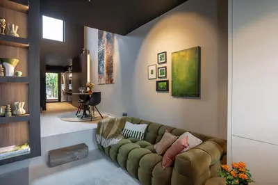 a living room with a couch and a table at Suite Escape in Hasselt