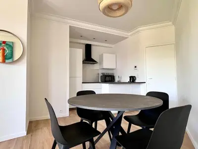 a dining room with a table and chairs at Cozy and fully equipped in the center of Liege 4 guests in Liège