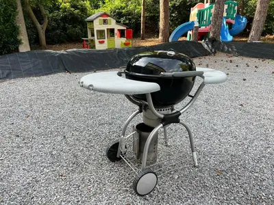 a barbecue grill on a cart in a playground at Casa Sahara - 8 guests - near nature reserve in Lommel