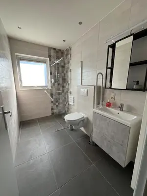 a bathroom with a toilet and a sink and a tub at Casa Sahara - 8 guests - near nature reserve in Lommel