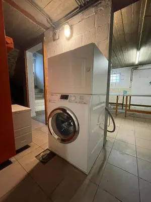 a washer and dryer in a room at Villa les Hauts de Heusy in Verviers