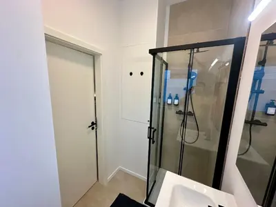 a bathroom with a shower and a sink at L éclipse - Luxe moderniste en plein cœur de Liège in Liège