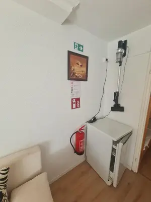 a room with a white wall with a machine in it at Pause Nature N in La Calamine