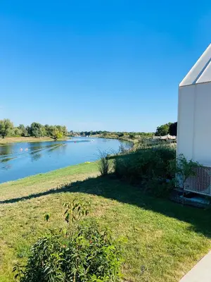 a view of a river from a house at Mase waterunits 6 & 7 in Maaseik