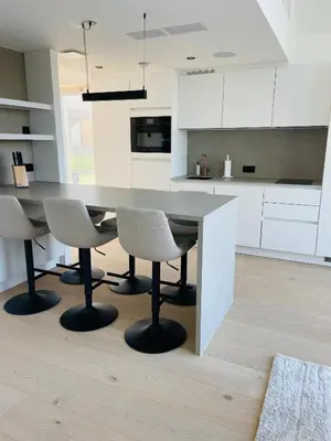 a kitchen with a large table and chairs at Mase waterunits 6 & 7 in Maaseik