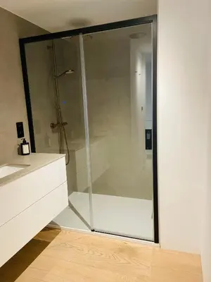 a shower with a glass door in a bathroom at Mase waterunits 6 & 7 in Maaseik