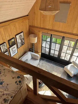 a room with a bed and a table in a cabin at Green Oak House in Dilsen-Stokkem