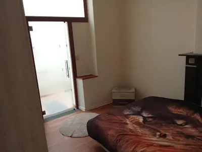a bedroom with a large bed in a room at Night in Liège