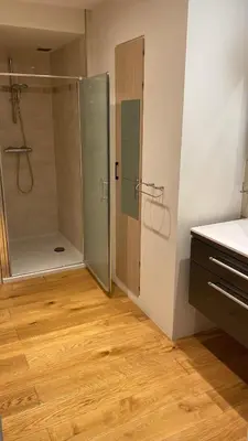 a bathroom with a shower and a glass shower stall at Residentie Ons Genoegen in Lommel