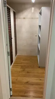 a room with a hallway with a wooden floor at Residentie Ons Genoegen in Lommel