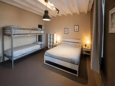 a bedroom with two bunk beds in a room at Holiday home with garden and roofed terrace in Heers