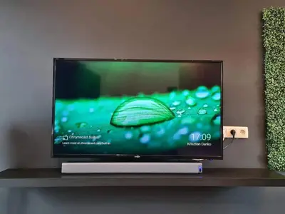 a flat screen tv sitting on a shelf at Elegant loft in Liège with private terrace in Mellet