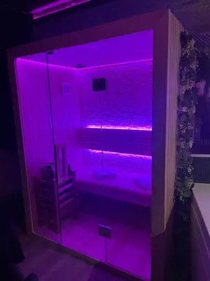 a room with purple lights in a room at Pause Thermale Suite in Herstal