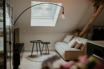 a living room with a couch and a table at Molhemhoeve in Peer