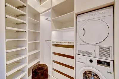 a laundry room with a washer and dryer at L'Escapade in Liège