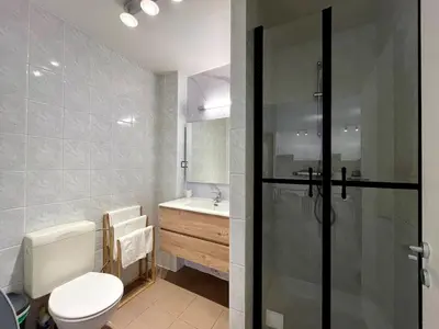 a bathroom with a toilet and a sink and a shower at Saint Leonard in Liège
