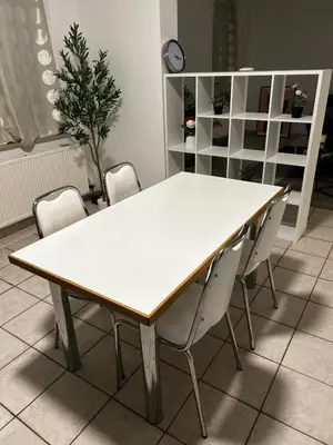 a white table and chairs in a room at Grâce à Liège in Grâce-Hollogne