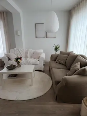 a living room with a couch and a table at Verliefd in Brustem in Sint-Truiden