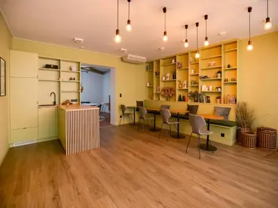 a room with a table and chairs and shelves at Holiday home in the heart of Hasselt in Hasselt
