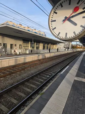 a large clock on the side of a train station at Vintage Station in Ans