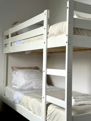 a couple of bunk beds in a room with a bed at Dukes View -explore Haspengouw & surrounding towns in Zoutleeuw