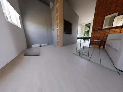 a living room with a couch and a television at Apartment in Bree for a family in Bree