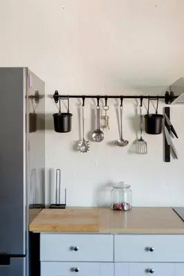 a kitchen with pots and pans hanging from the wall at L'appartement Casquette in Liège