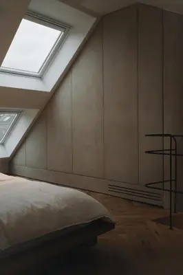 a bedroom with a bed and a skylight at number nine house in Hasselt