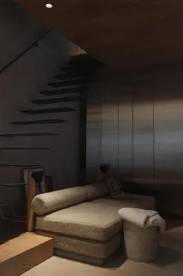 a bedroom with a bed and a staircase at number nine house in Hasselt