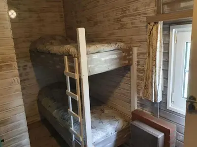 a set of bunk beds in a log cabin at Lanklaar Chalet with Garden in Lanklaar
