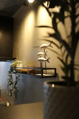 a wall with a table with an umbrella on it at Casa Verde in Maasmechelen