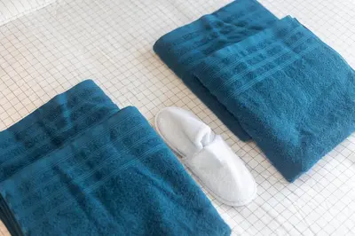 a pair of socks and a pair of shoes on a table at Moni 2D Residence in Seraing