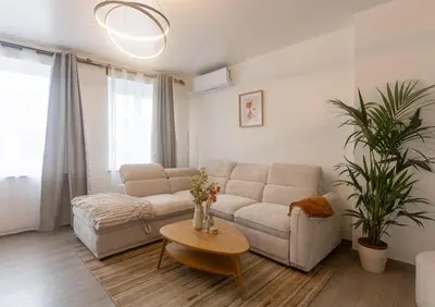 a living room with a couch and a table at Moni 2D Residence in Seraing