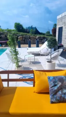 a view of a patio with a table and chairs at Villa Marvin in Soumagne