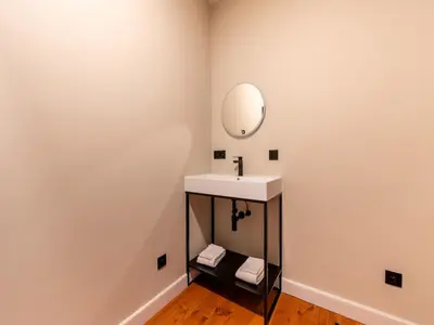 a bathroom with a sink and a mirror at Picturesque mansion with garden in Tongeren in Tongeren