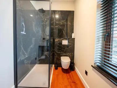 a bathroom with a shower with a toilet at Picturesque mansion with garden in Tongeren in Tongeren