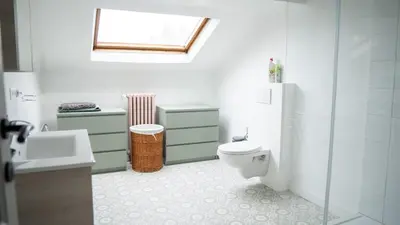 a bathroom with a toilet and a sink and a window at Nomad Home - Bronckart 10 in Liège