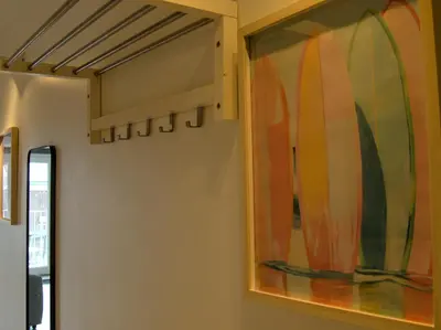 a painting of surfboards hanging on a wall at Le Liégeois - Confort au Centre Ville in Liège