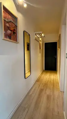 an empty hallway with a mirror on the wall at Le Liégeois - Confort au Centre Ville in Liège