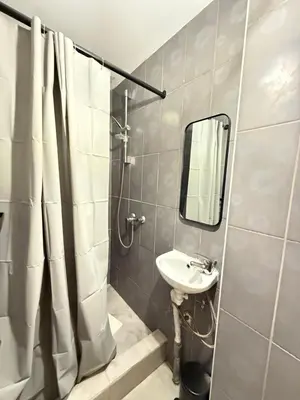 a bathroom with a sink and a mirror at Duplexe Cosy - HERSTAL in Herstal
