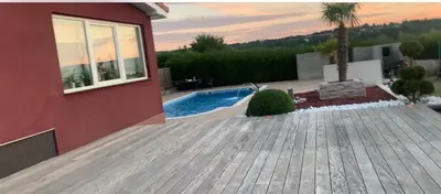 a house with a swimming pool next to a house at Villa a Chaudfontaine in Chaudfontaine