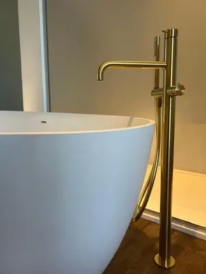 a white bath tub with a faucet in a bathroom at Villa de Fraiture in Geetbets