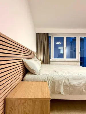 a bedroom with a bed and a window at Studio moderne au coeur du quartier Saint Adalbert in Liège