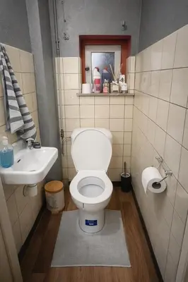 a bathroom with a toilet and a sink at Studio by Seniko in Liège