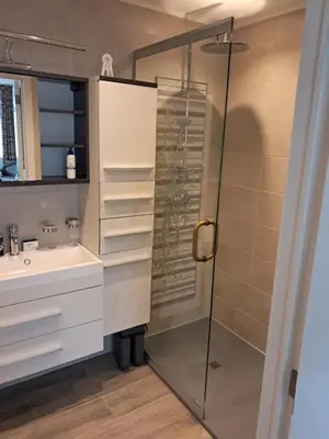 a bathroom with a shower and a sink at Domus moerenpoort in Tongeren
