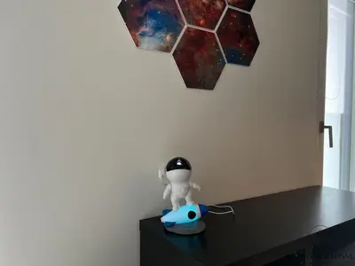 a toy figurine on a table with a star on the wall at La parenthèse céleste - 2 chambres & Sauna in Liège