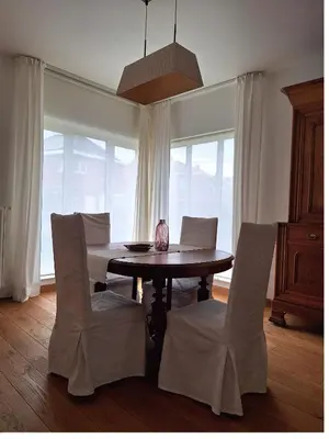 a dining room with a table and chairs at Villa Bonifica in Riemst