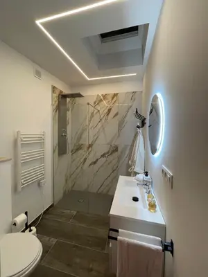 a bathroom with a toilet and a sink and a shower at Charnel - Bora Bora in Liège