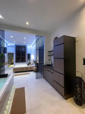 a living room with a dresser and a couch at Charnel - Bora Bora in Liège